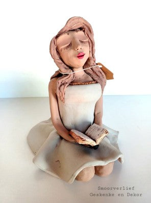 Pottery sit poppie met gesig